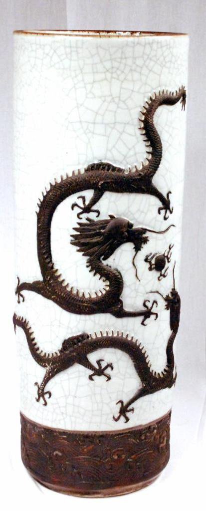 Chinese Crackleware Umbrella Stand: Chinese crackleware umbrella stand, with dragon motif. Signed underneath and made of ceramic. 19th century. In good condition. 25" high.
