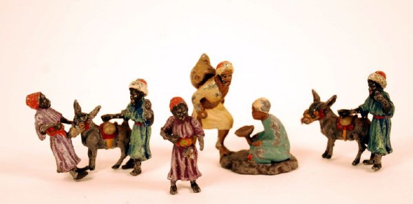 Painted Lead Miniature Arabic Figures: Painted lead miniature Arabic figures, four pieces in all depicting every day life. Worn painted surfaces, one figure will not stand up. 1 1/2" high, 1" wide. (4 pc)