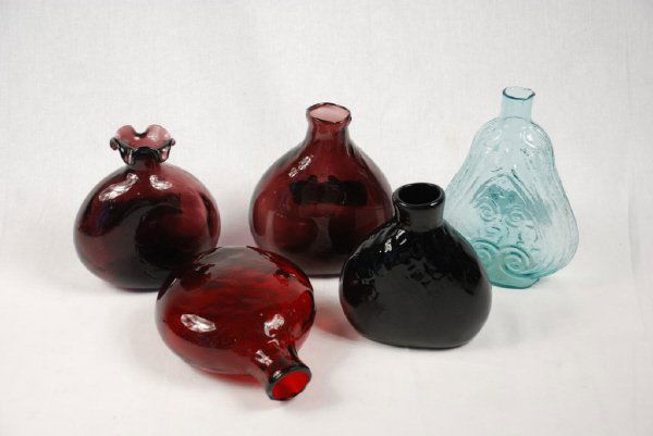 Five Whiskey and Liqueur Flasks: Five whiskey and liqueur flasks of undetermined age. Various colors included. Size varies 5-7" high, 5" wide.