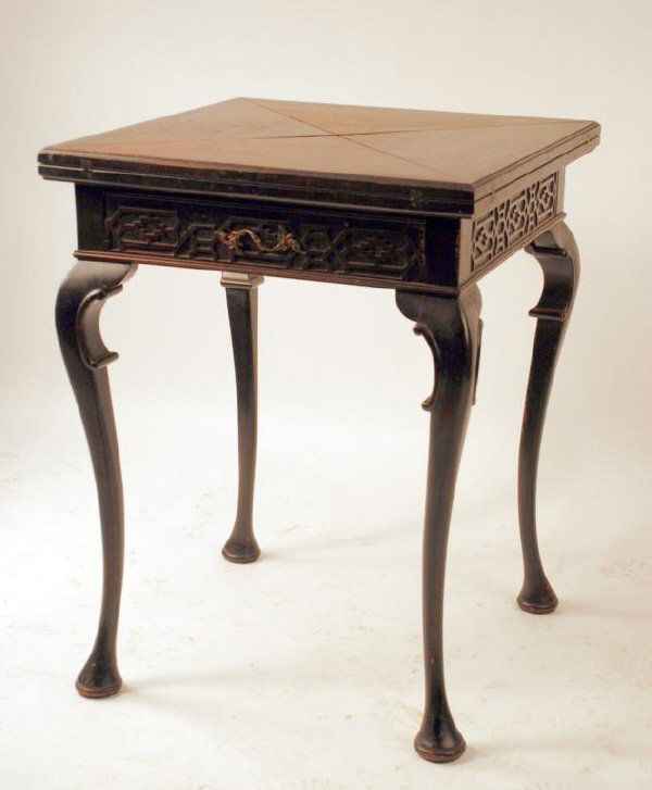 Handkerchief Mahogany Card Table: Chippendale revival mahogany handkerchief folding card table, set on cabriole legs with blind applied fret work carvings on the skirt and claw feet. Fitted with one drawer and felt center pad. England