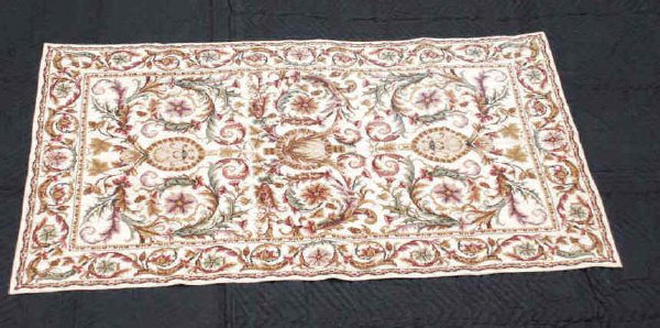 Handmade Needlepoint Rug: Handmade needlepoint rug/wall hanger made in the USA, Durham NC. With a white field and fern like leafage. In good condition. 59" long, 35' wide.