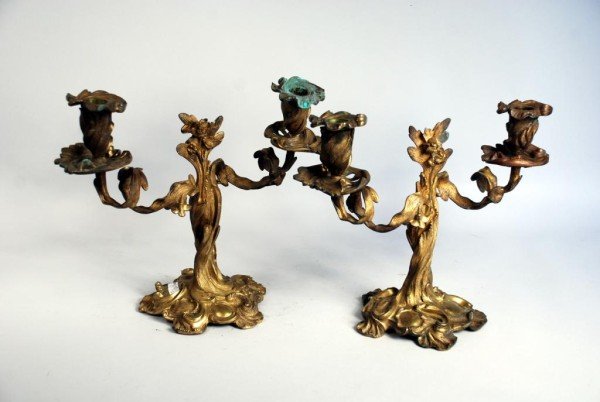 Pair of Rococo Ormolu Candelabra: Pair of Rococo style ormolu two-arm candelabra of foliate design. 11" high, 13 1/2" wide, 6" diameter. Provenance: A California private collector.