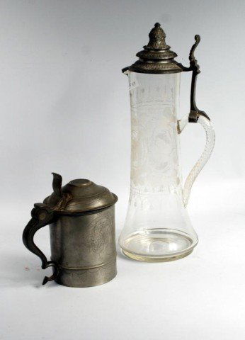 Bohemian Glass Pewter Flagon & Tankard: Bohemian etched glass and pewter tall flagon, together with a Swedish 18th century pewter tankard. Flagon 17" high, 6" diameter (base). Tankard 7 1/2" high, 5" diameter (top). Provenance: A California