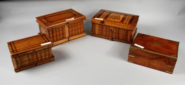 Group of Four Boxes, 19th C.: Group of four boxes, comprising three puzzle boxes (one with a marquetry top) and a rosewood brass bound box. Largest 5" high, 9" wide, 6" deep. Smallest 4" high, 7" wide, 4 1/2" deep. Provenance: A C