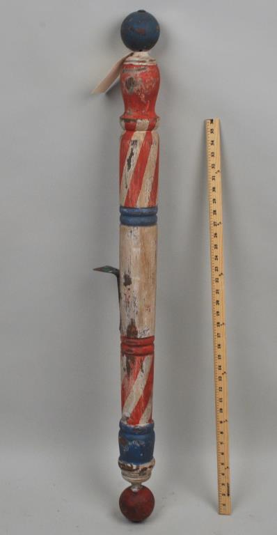 Folk Art Painted Wood Barber Pole Trade Sign: ring and column turned, with ball finials, 19th century. 44 1/2" high, 3" diameter. Losses to painted surface, expected wear. Provenance: Property of a Litchfield County Collector.