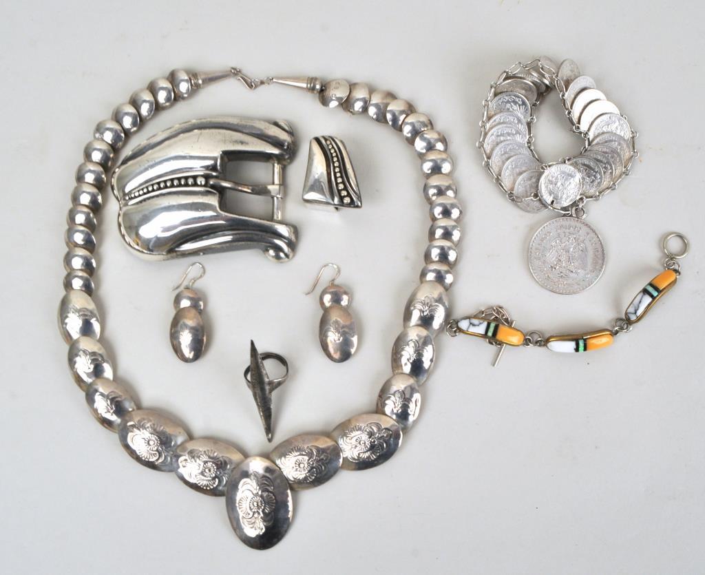 Group Silver Native American/Mexican Jewelry: comprising stamped necklace and earrings marked Sterling CSD, Zuni buffalo turquoise bracelet, Mexican .950 buckle and keeper, coin silver bracelet and ethnic ring. Weighable silver: 7.865 OZT. Larges