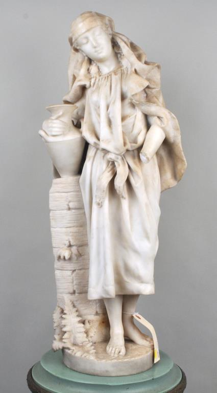 Carved Marble "Rebecca At The Well": finely carved standing figure with amphora, unsigned. Probably late 19th/early 20th century.. 29 1/2" high, 14" wide, 8" diameter base. One hand and finger broken, with most pieces present. Provenance