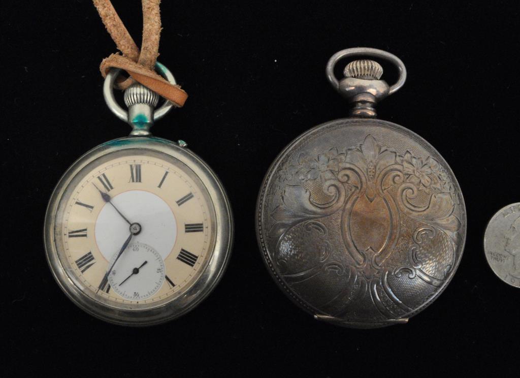 Two Vintage Mens' Pocket Watches: comprising Elgin coin silver and a Longines watch. Largest: 2 1/8" diameter. Use wear, dents, green discoloration to smaller. Provenance: Property of a Rockland County, NY Estate. We offer in-house pa