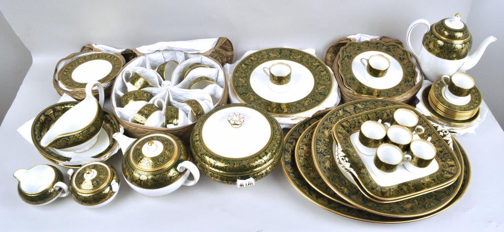 Wedgwood Porcelain Partial Service: in the "Florentine" pattern, comprising 8 dinner plates, 8 shaped salad plates, 8 butter plates, 8 teacups and saucers, 8 demitasse and saucers, teapot, coffee pot, sugar, creamer, covered vegetable, 