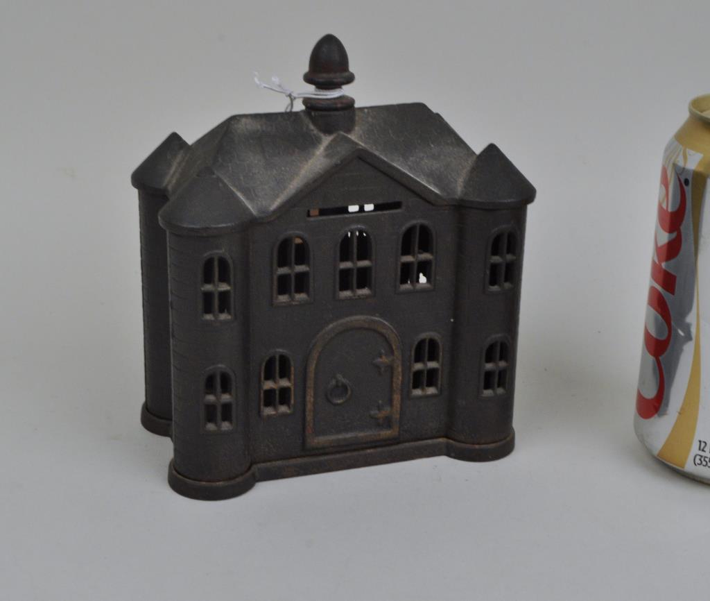 Vintage Castle Form Cast Iron Still Bank: 5 1/2" high, 4 3/4" wide, 3" deep. Oxidation, loss to one upper window. Provenance: Property of a Woodbury CT Estate. We offer in-house packing and shipping of this item to an address in the United St