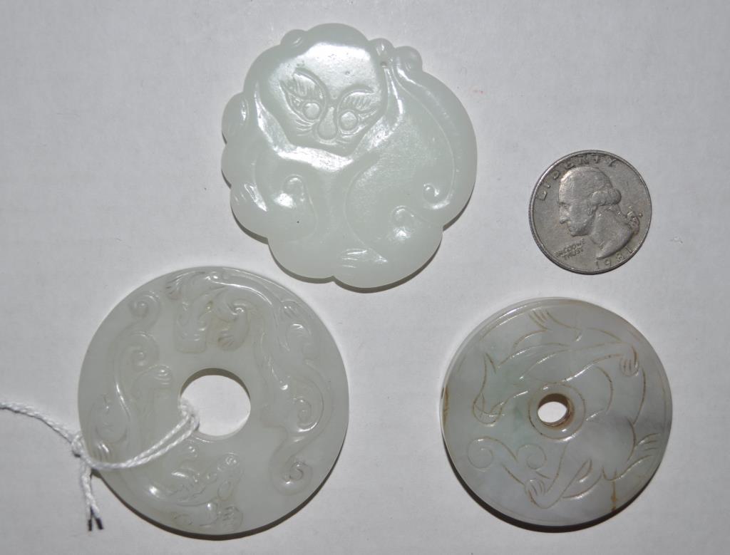 Three Chinese Carved Jade/Hardstone Round Plaques: the largest with two circling dragons. Largest: 2" diameter. We offer in-house packing and shipping of this item to an address in the United States for $45.00 via USPS Priority Mail. The price include
