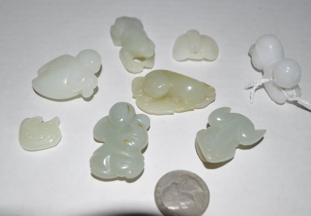 Eight Chinese Jade/Hardstone Figural Carvings: the group of small carvings including: kneeling child, frog, duck, bat and others. Largest: 1 1/4" high, 1 1/2" long. We offer in-house packing and shipping of this item to an address in the United St
