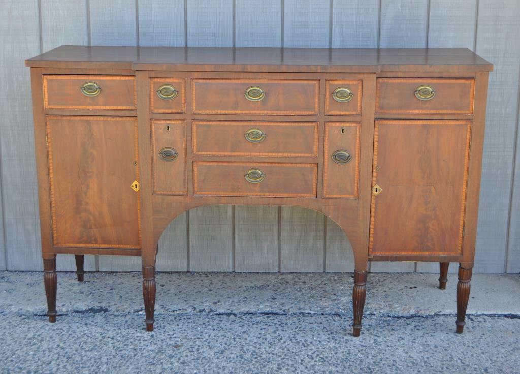 Federal Inlaid Mahogany Sideboard/Server: of breakfront form, apparently original oval brasses, three upper drawers above four cabinet doors, all with tiger maple banding. 40" high, 64" long, 21" deep. Some restorations.