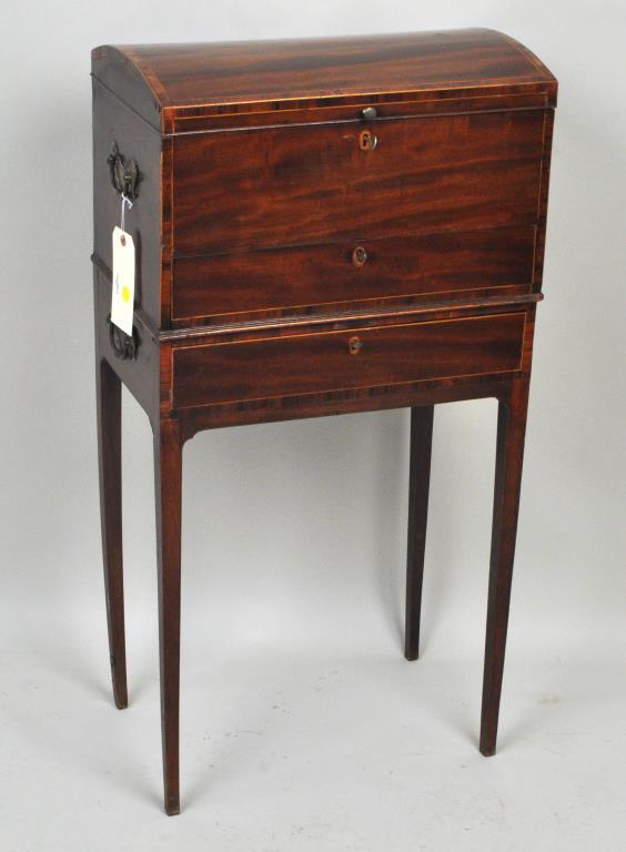English Inlaid Mahogany Silver Chest, 19th C.: in two parts, the upper with domed top and one lower drawer, on a base with one drawer. Some minor veneer repairs and warping to some legs. 30" high, 19" wide, 12" deep.