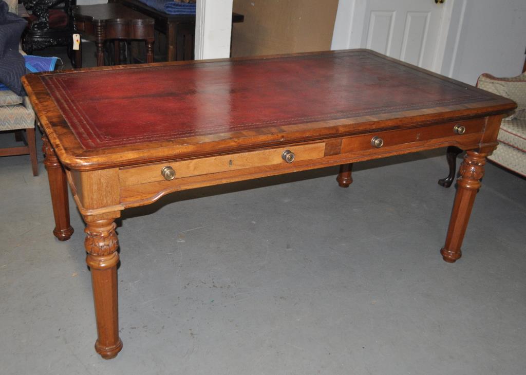 William IV Mahogany Leather Top Writing Table: molded frame and red tooled leather top with pairs of opposing frieze drawers, on carved and faceted tapering legs. 30 1/2" high, 72" wide, 40" deep. Wear and some light damage to leather surface. Pro