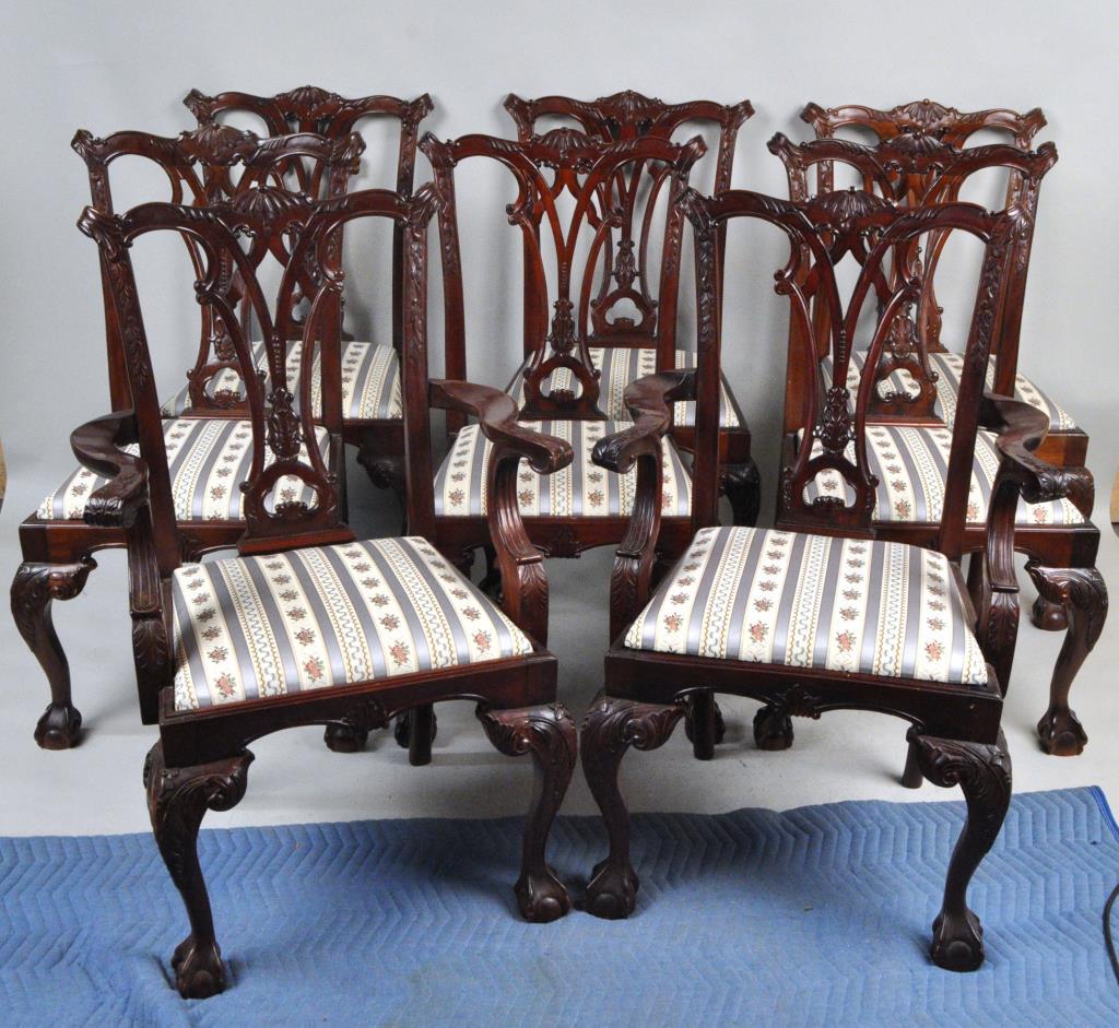 Set Eight Chippendale Style Dining Chairs: comprising two arm and six side chairs, all elaborately carved with nicely upholstered slip seats, please view images. Largest: 40" high, 25" wide, 21" deep. Break to one splat, other expected age and