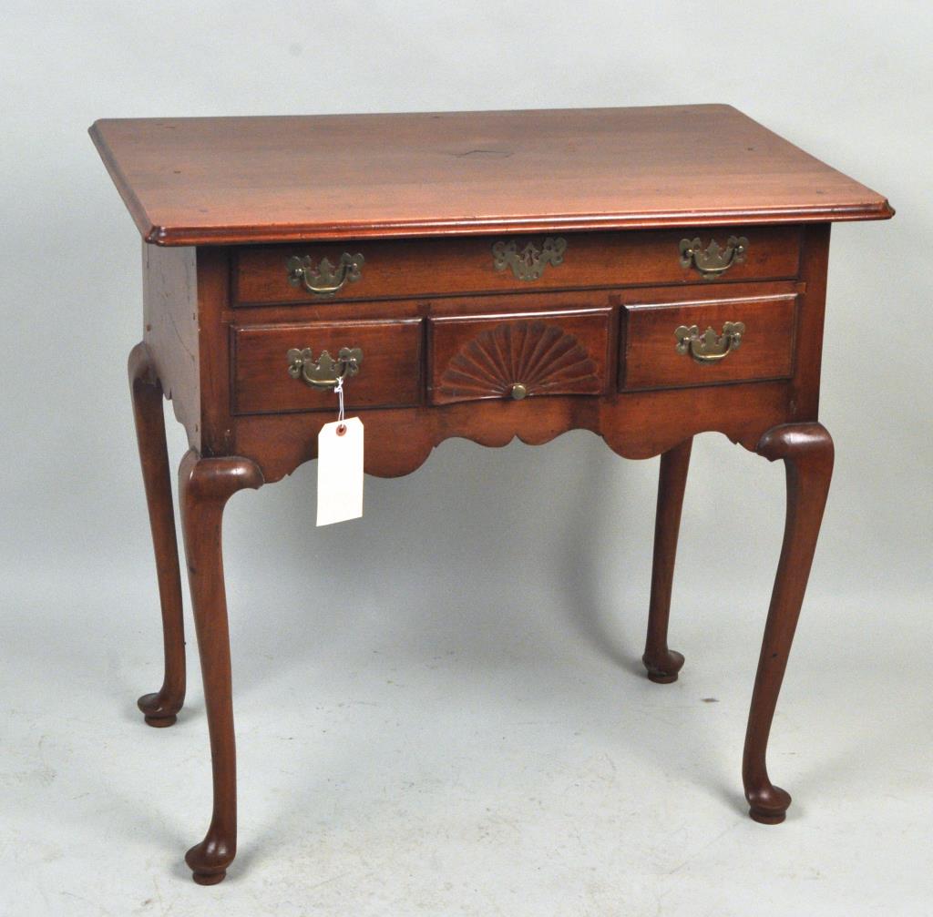 CT Queen Anne Shell Carved Cherrywood Lowboy: with one long drawer, two drawers flanking shell carved central drawer, delicate cabriole legs and pad feet. 32" high, 33 1/2" wide, 21" deep. Restorations, including the top.