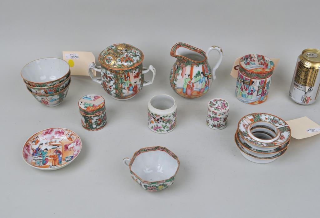 Group 13 Chinese Rose Medallion Porcelain Wares: comprising a pitcher, three tea bowls, a cup/saucer, four covered jars, a covered soup, and three dish rings. Largest: 5 1/4" high, 6" wide. Edge chips, hairline cracks to tea bowls, one jar lacking l