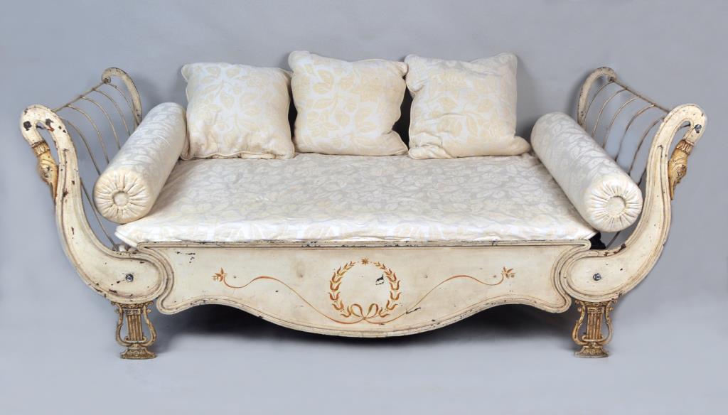 French Empire Neoclassical Painted Iron Daybed: with swan head and lyre facade. Pictured p.130 de Dampierre "French Chic". 38 1/4" high, 93 7/8" long, 37 1/4" deep, seat height 21". Paint wear, missing casters, one detached bolt. Provenance: Proper