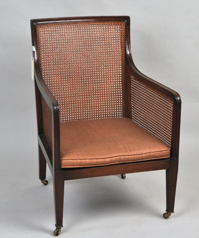 Regency Style Caned Mahogany Library Armchair: 36" high, 24" wide, 24 1/2" deep at the base, seat height: 12 3/4" without the cushion. Caning is very nice and clean, one spot of damage to the right arm, and one spot to mid left of back. Chair has 