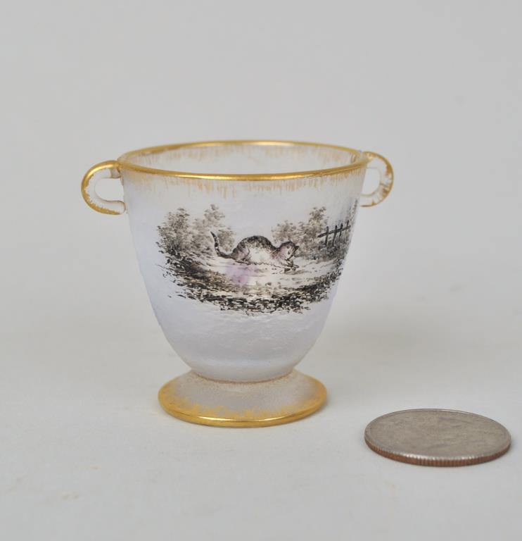 Daum Diminutive Cameo Glass Cup: cat playing with mouse on one side, bleeding heart flowers verso. Signed Daum Nancy on base. 1 3/4" high, 1 3/4" diameter. Light gilt loss.