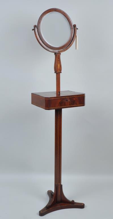 Biedermeier Inlaid Mahogany Dressing Mirror/Stand: with diamond inlaid trim, urn design under mirror. 63 1/2" high (adjustable up), 15 1/4" wide, 12 1/8" deep. Veneer losses, splitting, missing escutcheon. Provenance: Property from a NYC Estate.