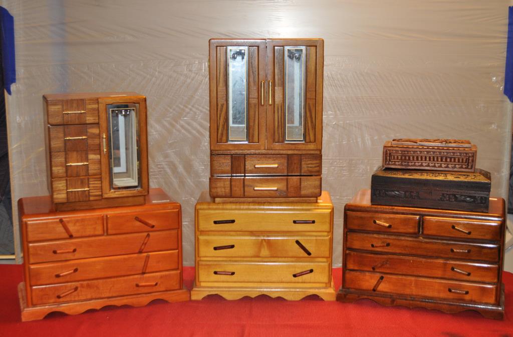 Seven Vintage Wood Jewelry Boxes: the largest: 11" high, 16" wide. Use wear. We offer in-house packing and shipping of this item to an address in the United States for $45.00 via USPS Priority Mail. The price includes insurance up to