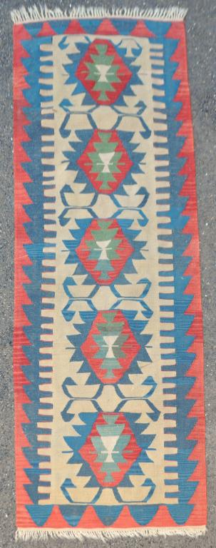 Kilim Rug: 92 1/4" long, 31 1/2" wide. Light staining, areas of separation. All rugs sold as is.