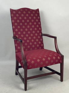 Hepplewhite Style Upholstered Lolling Chair: in mahogany, with arched crest and bowed front, molded legs and arms. 42 1/2" hig, 25" wide, 24" deep. Upholstery in clean, usable condition, light scuffs to wood, a couple dings to arms. Provenance: