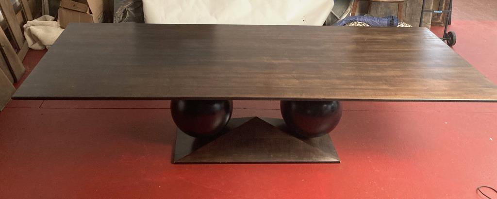 Charak Modern Walnut Dining Table, Ball Form Bases: a large stylish design table, with grained walnut veneered chamfered undercut top, supported on two large ebonized spheres resting on a similarly shaped but smaller rectangular chamfered base. 29 3/4"