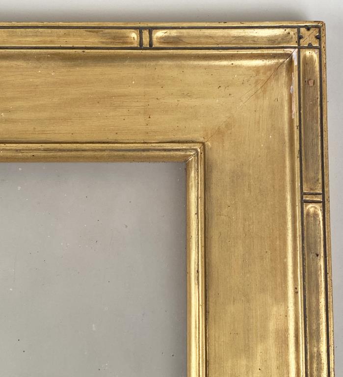 Newcomb Macklin Gilt Picture Frame: with label, verso, with glass. Frame: 28 5/8" high, 16 5/8" wide. Rabbet: 14 1/8" high, 10 1/8" wide. Estate found, barn stored condition, gilt wear, edge losses, soiling.