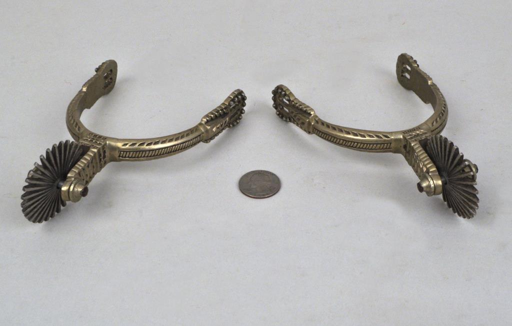 Pair Brass Gaucho Style Spurs: with typical geometric detail, 20th century. 6 1/2" long, 4" wide. Provenance: Property of a New Haven, CT Collector.