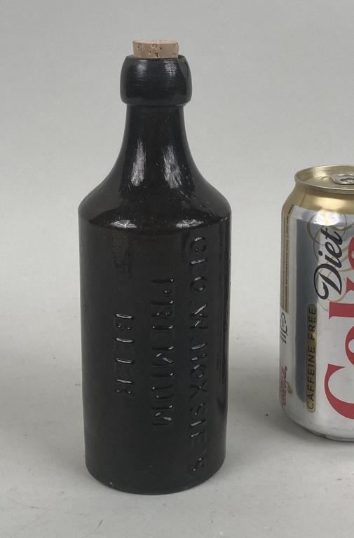 George W. Hotsies Premium Beer Bottle: possibly Westford Glass Works, Westford, Connecticut (1857-1873) cylindrical, dark olive and amber. 7 1/2" high, 2 3/4" diameter.