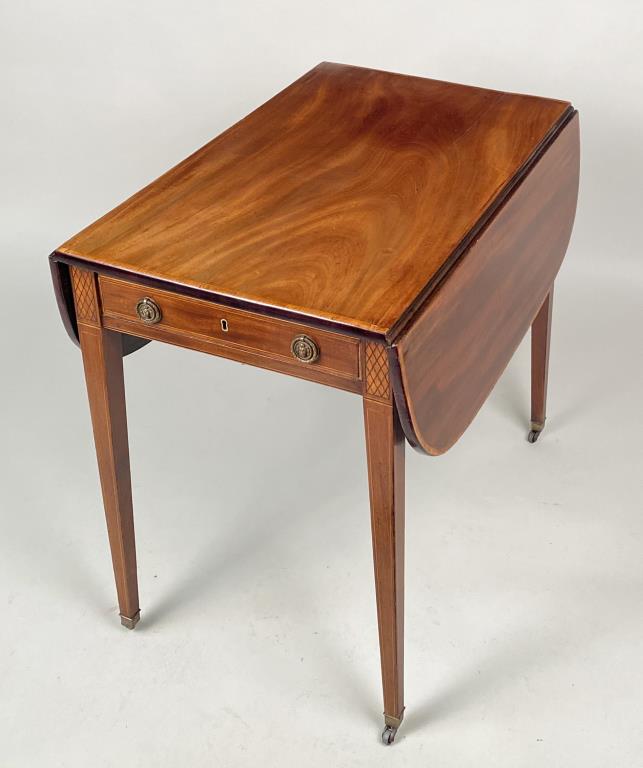 Late George III Mahogany Pembroke Table: with lion drawer pulls. 27 1/4" high, 20" wide closed, 40" open, 29 3/4" deep. Faded top, some splitting and veneer wear. Property from the Estates of Eve & Peter Mancino, Bridgewater, CT.
