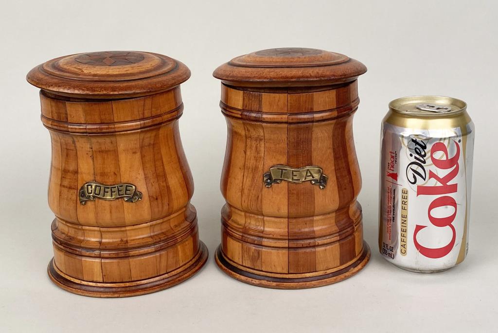 Pair Victorian Treen Canisters, Inlaid Lids: 6 1/4" high, 4 7/8" diameter. Light splitting, light use wear. Property from the Estates of Eve & Peter Mancino, Bridgewater, CT.