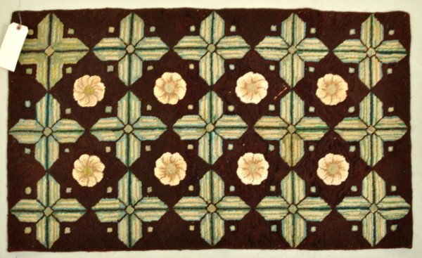 American Hooked Rug: American hooked rug, hooked throw rug with star and flower pattern on a reddish-brown field, early 20th century. Small areas of loss consistent with age. 44" high, 26 1/2" wide