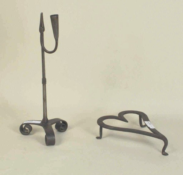 Iron Trivet and Iron Rush Light, 19th C.: Forged iron, heart-shaped trivet and rush light. 1 3/4" high, 7 1/2" wide, 5 1/2" deep; 12" high, 4" wide, 4" deep. From a Connecticut collection.