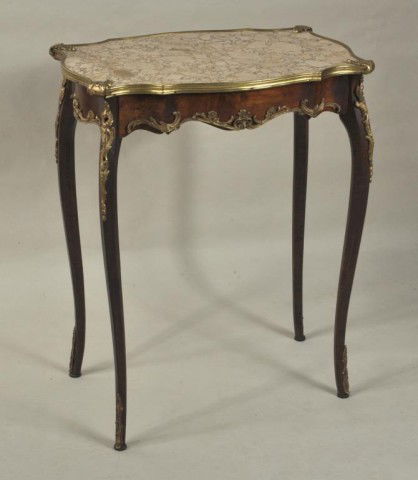 Louis XV Style Walnut & Marble Side Table: Louis XV style walnut and marble side table, the shaped marble top with applied brass edge overhanging a conforming base raised on slender cabriole legs embellished with foliate ormolu mounts, bearing