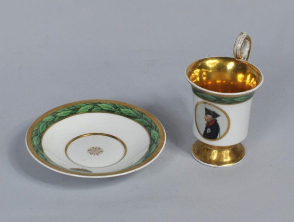 KPM Porcelain Cup and Saucer: European porcelain cup and saucer marked KPM. 5 1/4" high including plate. From a Virginia collector.