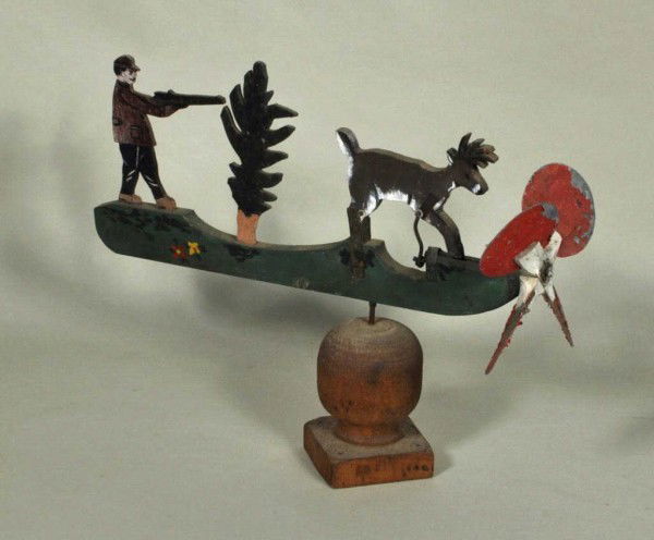 Folk Art Painted Whirlygig: Folk art painted whirlygig of a hunter and a deer, with some losses to paint, circa 1920s. 18 1/2" high, 24" wide, 5" deep. From a Connecticut collection.