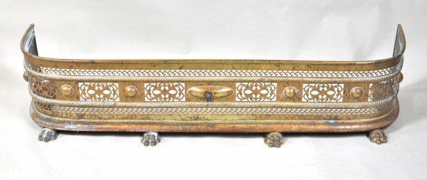 Pierced Brass Fender, 19th C.: Pierced brass "D" shaped fire fender with brass paw feet, 19th century. 11 1/4" high, 52" wide, 13 1/2" deep From a Connecticut gentleman.