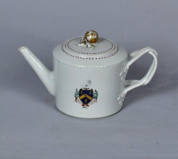 Chinese Export Teapot, Fiott Crest: Chinese Export blue and white porcelain drum-form teapot for the English market, circa 1800, decorated with Fiott family crest. 4 1/2" diameter, 5" high, 9" extreme length.