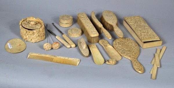 18 Piece Chinese Carved Ivory Dressing Set: 18-piece Chinese carved ivory dressing set, including 2 hatpins, brushes, comb, shoehorns, boxes, nail buffer. Brushes, comb, hatpins and nail buffer intact; boxes and other pieces broken, missing pie