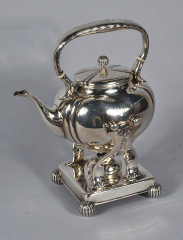 Whiting Sterling Silver Tea Pot on Stand: Whiting Mfg. Co. sterling silver tea pot on stand with burner, tipping lid missing pin. 45.75 troy oz. Whiting was absorbed by Gorham in 1926. 13" high, 10" wide, 6 3/4" deep.