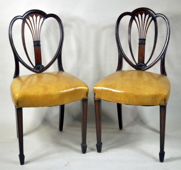 Pair Baltimore Style Heart Back Side Chairs: Pair of inlaid hepplewhite style heart back side chairs, with racquet back and spade feet, in the Baltimore manner. 37" high, 20" wide, 17 3/4" deep. Some repairs and losses.