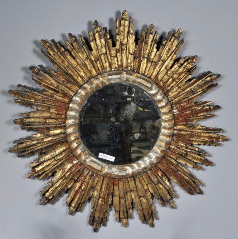 Wood Sunburst Mirror: Wooden sunburst mirror, 20th century, light wear to ends. 25" diameter.