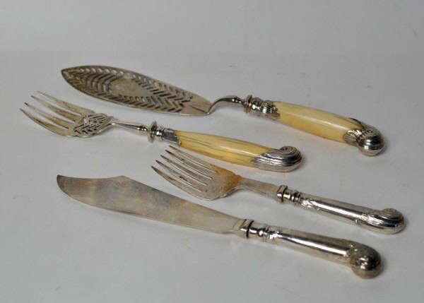 Two Pair Sterling Silver Fish Servers: Two pair of engraved bright cut sterling fish servers, one pair with bone handles comprising a server and a fork, and the other with filled sterling handles comprising a knife and a fork. 25.45 troy o