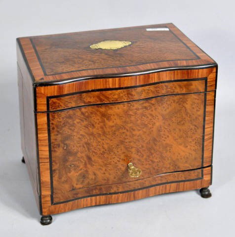 Late Regency Inlaid Rosewood Tantalus: Very fine inlaid rosewood tantalus, with lift top and gilt brass fitted interior with four decanters and twelve cordial glasses. England, 19th century. 10 1/2" high, 12 3/4" wide, 9 1/4" deep.