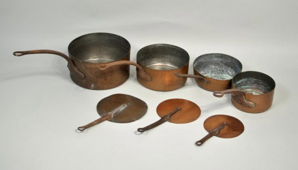 Group of Seven Copper Pots and Lids: Group of seven vintage French cooking pots with lids. largest 5 1/2" high, 21 1/2" wide, 10 1/2" deep.