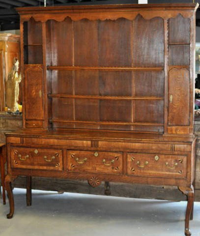 Georgian Inlaid Oak Welsh Dresser: Georgian inlaid oak two part welsh dresser, with dentil molded cornice above closed board upper section of shelves and flanking compartments and cupboards over small drawers, the lower section with th